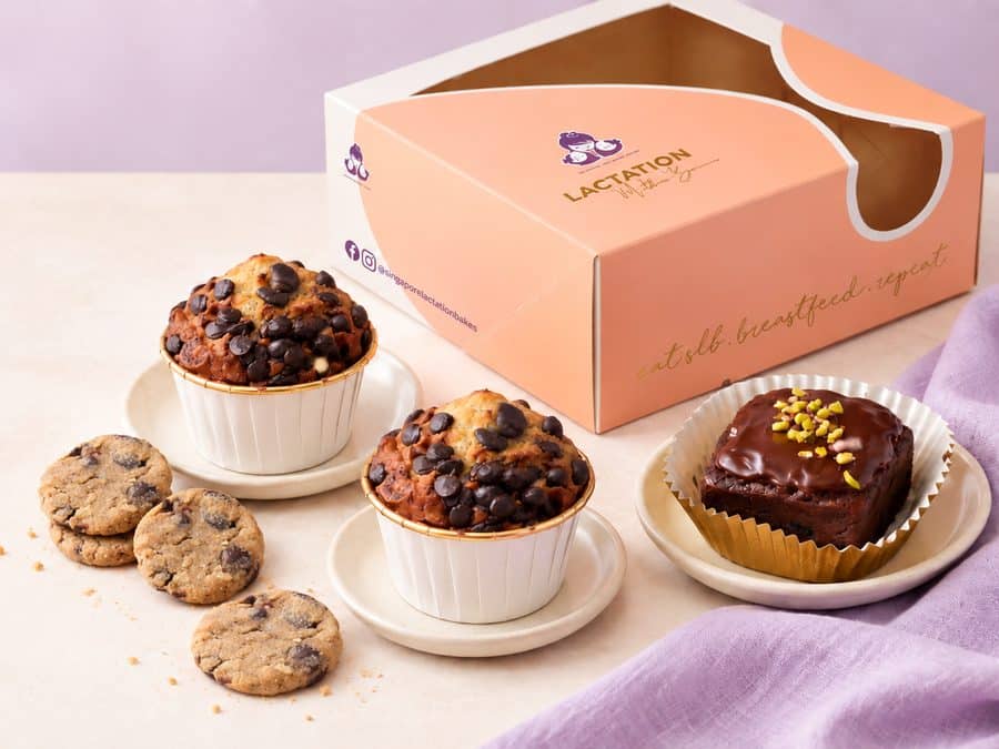 An SLB delivery box with muffins, cookies and a brownie